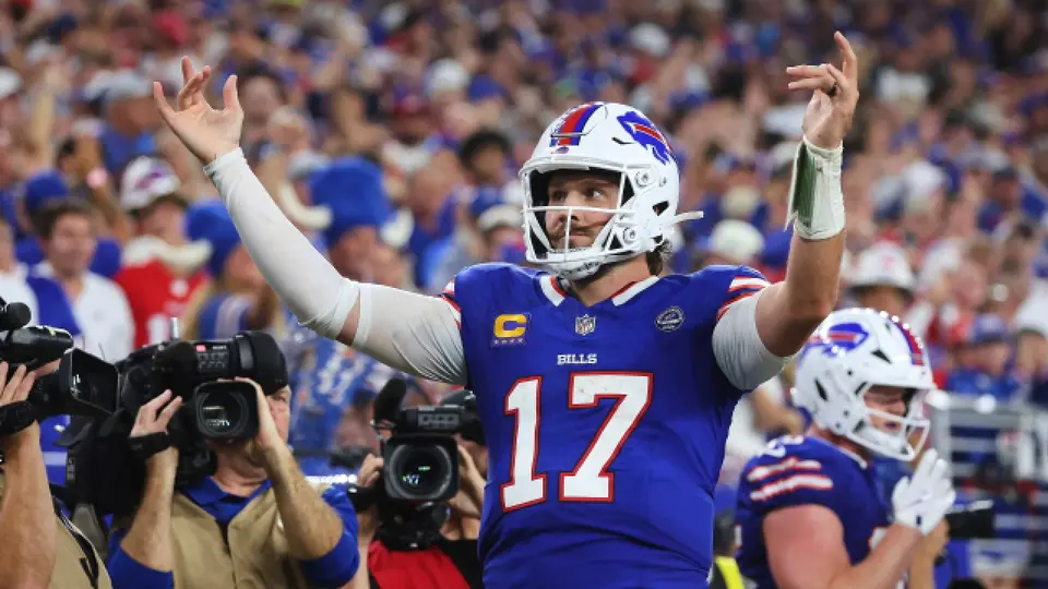 Josh Allen celebrando su quinta anotación ante los Lions | AP