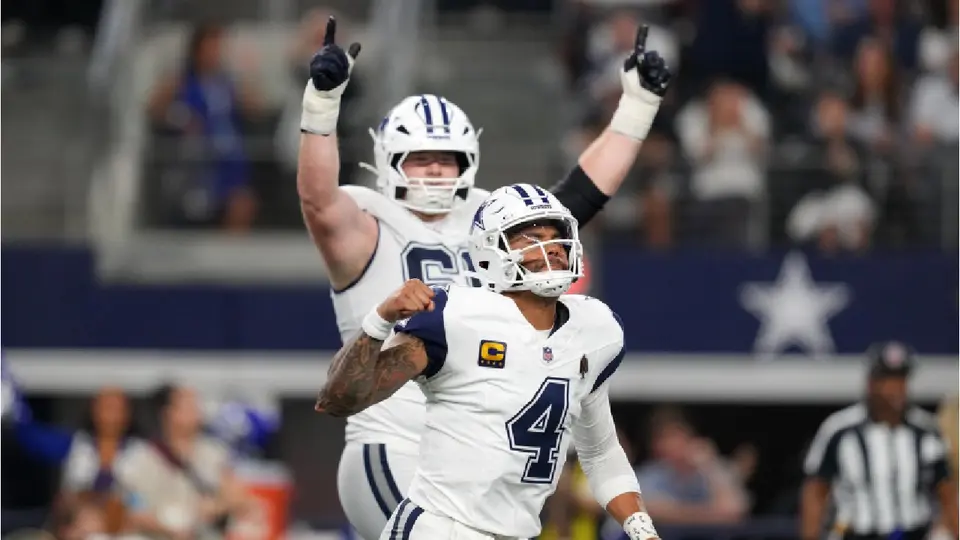 Dak Prescott celebrando pase de anotación ante los Commanders | AP