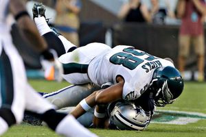 Lesión de Romo roba cámara a triunfo de Dallas