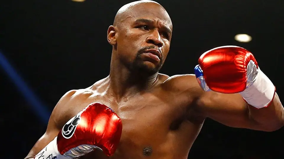 Mayweather ofrece ayudar a Rousey con su boxeo
