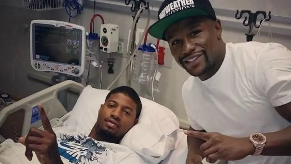 Mayweather visita a Paul George tras operación