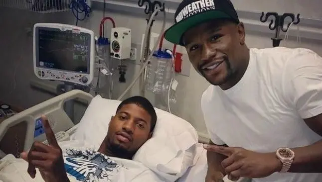 Mayweather visita a Paul George tras operación