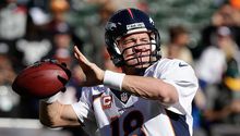 Manning rompe récord de más yardas por pase