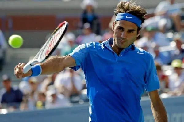 Federer cumple en primera ronda del US Open
