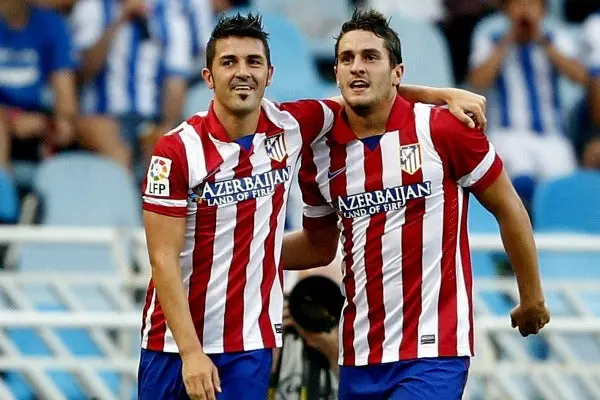 David Villa (izq.) celebra con su compañero Koke | EFE