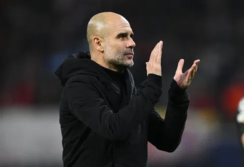 Pep Guardiola watching Man City in action