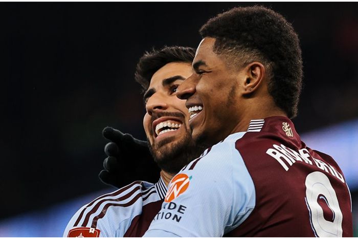 Marcus Rashford and Marco Asensio celebrate after Villa's latest goal.