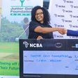 Nelly Wainaina (L) presents the sponsorship to JGF president Regina Gachora