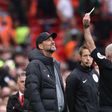 Liverpool manager Jurgen Klopp receives a yellow card