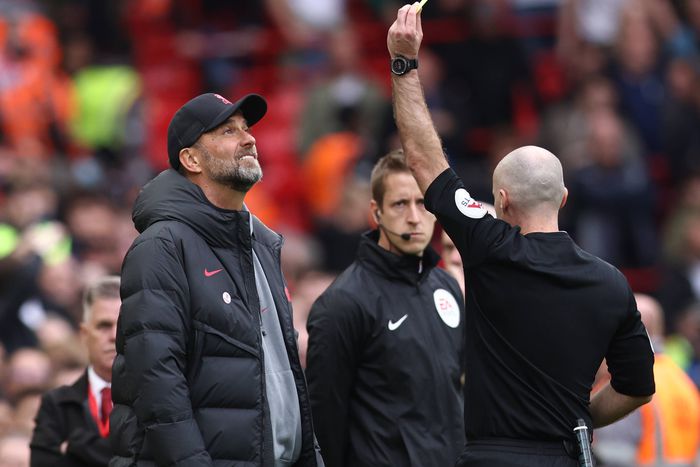 Liverpool manager Jurgen Klopp receives a yellow card