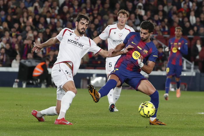 Osasuna vs Barcelona in La Liga action
