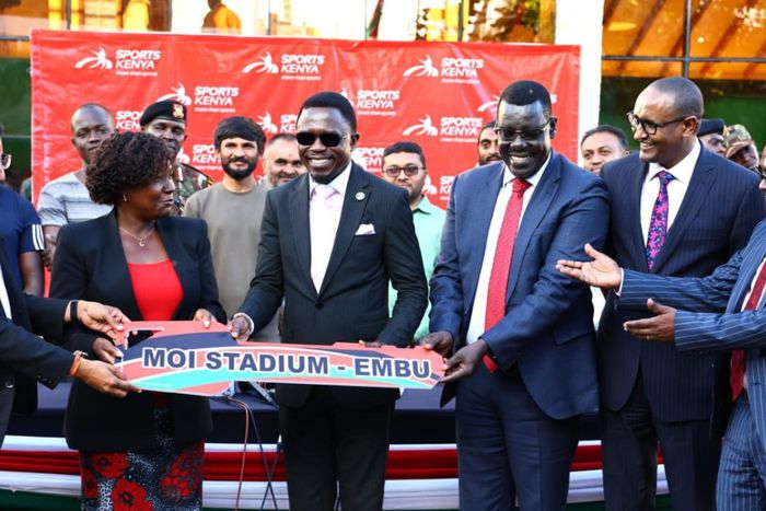 Sports SC Ababu Namwamba (C) during the hanging over ceremony of the Moi Stadium in Embu