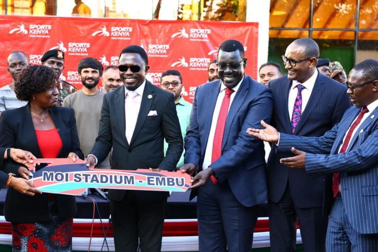 Sports SC Ababu Namwamba (C) during the hanging over ceremony of the Moi Stadium in Embu