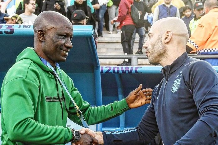 Flying Eagles coach Ladan Bosso exchange pleasantries with Argentina U20 coach Javier Mascherano