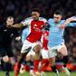 Arsenal's Declan Rice and Myles Lewis-Skelly battle with Manchester City's Phil Foden | Imago