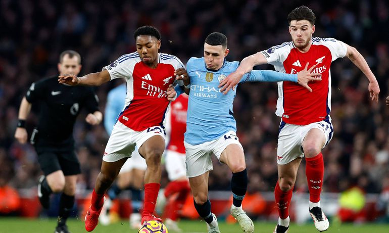 Arsenal's Declan Rice and Myles Lewis-Skelly battle with Manchester City's Phil Foden | Imago