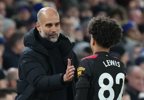 Manchester City boss Pep Guardiola with teenage star Rico Lewis