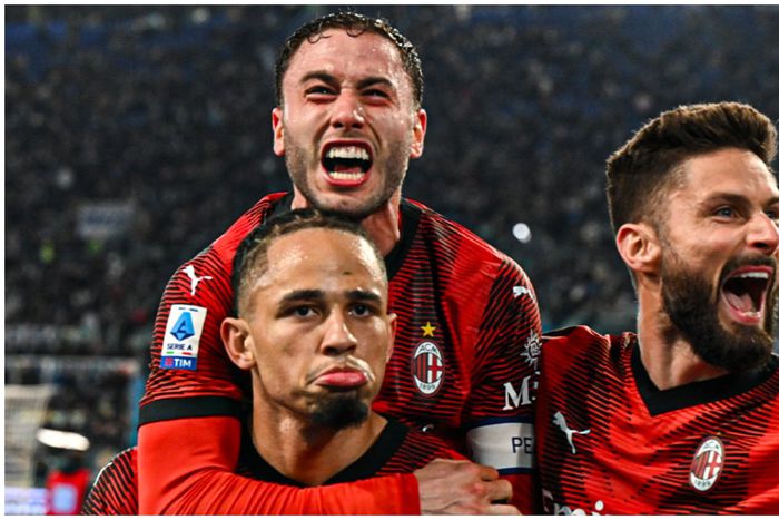 Noah Okafor celebrates with his Milan teammates.