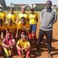 Undugu Queens FC players with their coaches