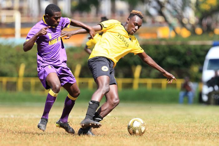 Wazito's Maxwell Odada challenges Mike Oduor of Tusker during their league encounter at the Ruaraka Stadium.