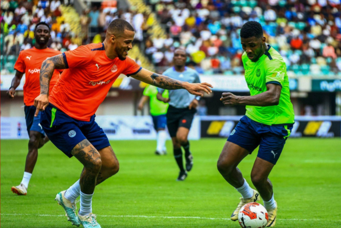 Troost Ekong and Kelechi Iheanacho of Nigeria during the William Troost Ekong Charity football match between Team Orange and Team Green at Godswill Akpabio Stadium on June 2, 2024 in Uyo, Nigeria. Photo by Oty Silas