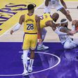 Miles Bridges 0 of the Charlotte Hornets battles for a lose ball with LeBron James 23 and Luka Doncic 77 of the Los Angeles Lakers