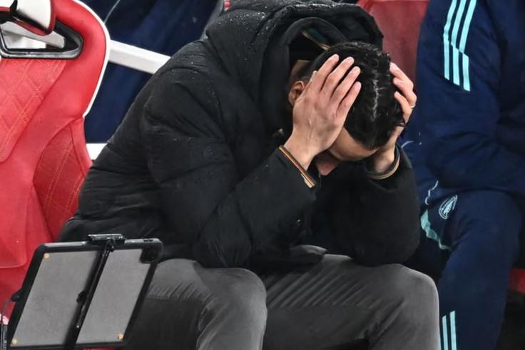 Ruben Amorim holds his head in frustration. Photograph: Dylan Martinez/Reuters