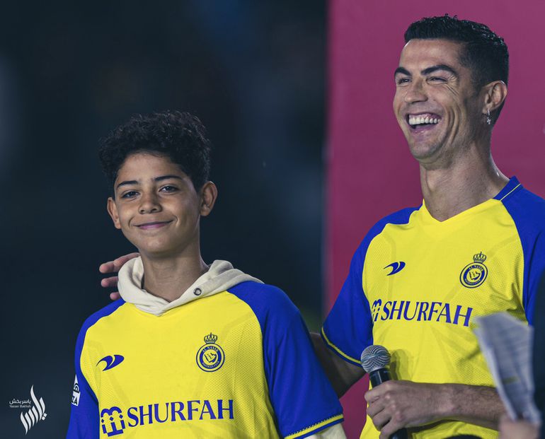 Ronaldo and his son at his unveiling for AL-Nassr