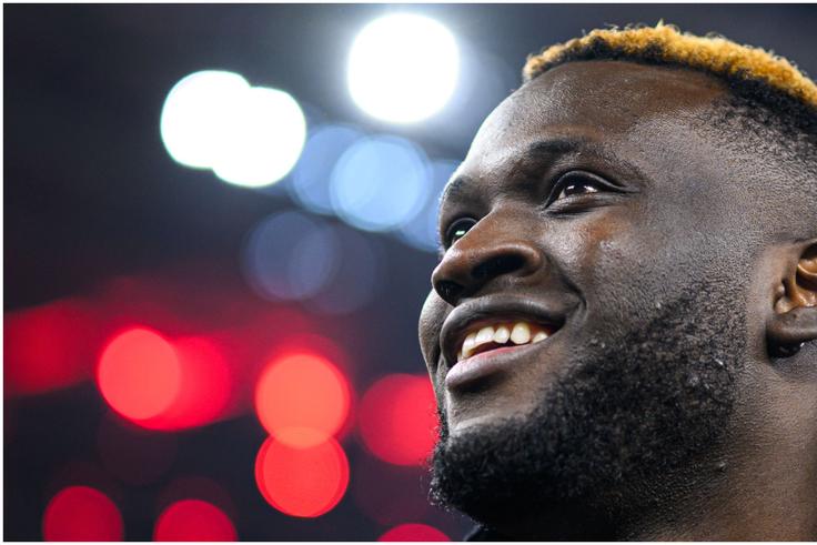 Victor Boniface smiles after his milestone moment for Leverkusen.