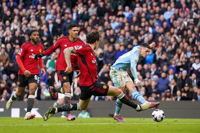 Manchester City s Phil Foden (right) scores their side s second goal of the game during the Premier League match at the Etihad Stadium, Manchester.  || Image credit: Imago