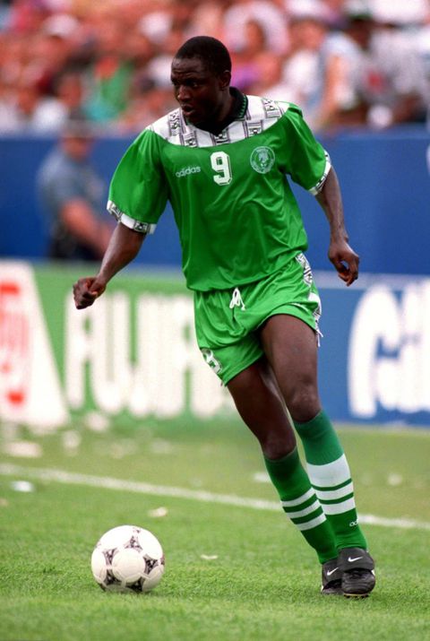 Super Eagles celebrate legend Rashidi Yekini for Nigeria's 1st World Cup goal, showing off tears and holding the net.