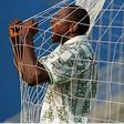 Super Eagles celebrate legend Rashidi Yekini for Nigeria's 1st World Cup goal, showing off tears and holding the net.
