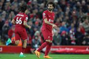 Salah models Liverpool's 'Super Eagles' Green and white away kit