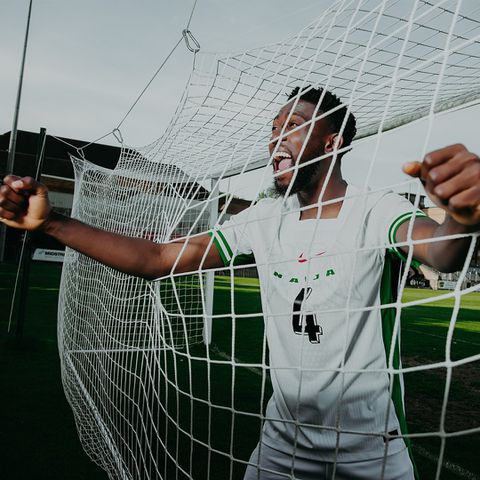 Super Eagles of Nigeria midfielder Wilfred Ndidi models new jersey ahead of South Africa World Cup qualifier.