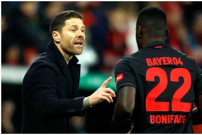 Bayer boss, Xabi Alonso, passes some instructions for Victor Boniface.