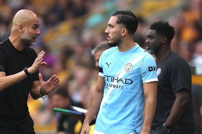 Pep Guardiola in a conversation with Rayan Cherki || Image credit: Imago