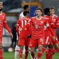 Bayern survive late scare to go top of the table