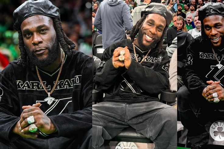 African giant Burna Boy watches the Boston Celtics destroy the Golden State Warriors.
