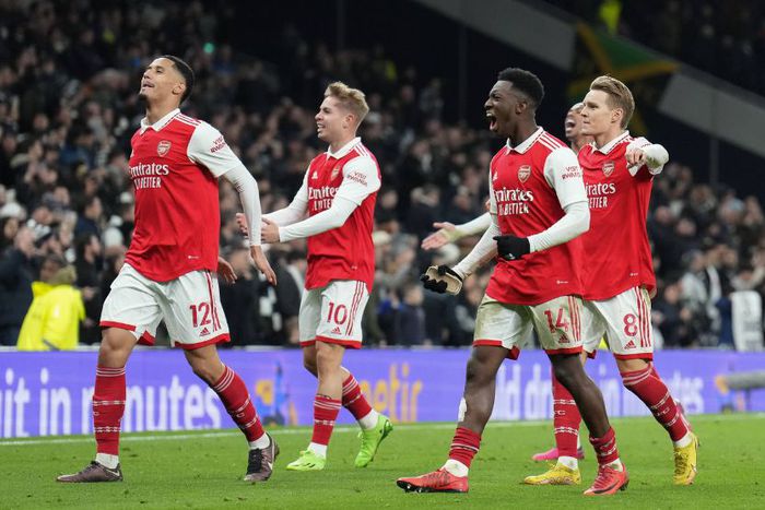 William Saliba (12) of Arsenal, Emile Smith Rowe (10), Eddie Nketiah (14) and Martin Odegaard (8) celebrate winning the Premier League match between Tottenham Hotspur and Arsenal at Tottenham Hotspur Stadium.