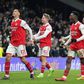 William Saliba (12) of Arsenal, Emile Smith Rowe (10), Eddie Nketiah (14) and Martin Odegaard (8) celebrate winning the Premier League match between Tottenham Hotspur and Arsenal at Tottenham Hotspur Stadium.