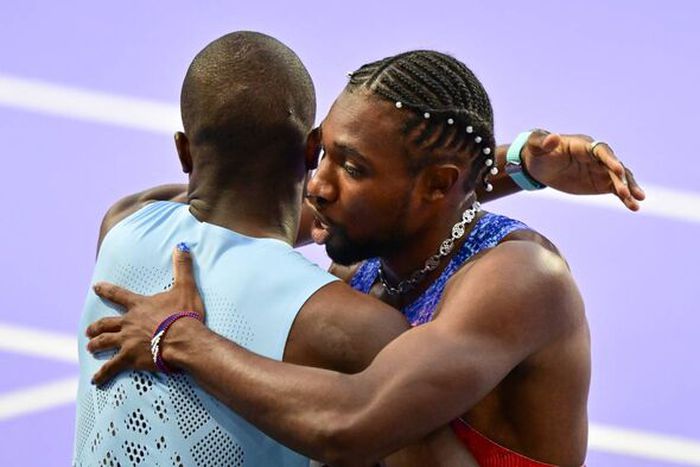 Letsile Tebogo and Noah Lyles after Olympic 200m final in Paris.