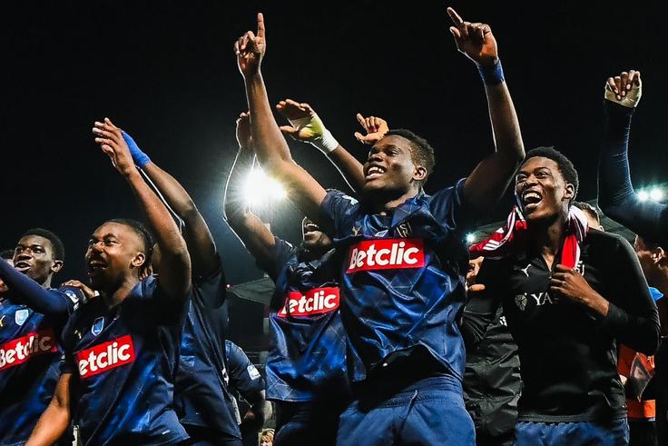 Hafiz Ibrahim celebrates the historic win with his Reims teammates. (Photo Credit: Reims/X)