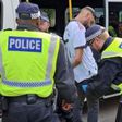 A fan being arrested for wearing an offensive shirt during 2023 FA Cup final.