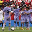 Real Madrid players celebrating Rodrygo's goal