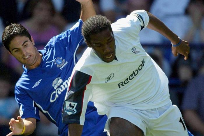 Mikel Arteta squaring up against J.J Okocha in the Premier League || Image credit: Imago