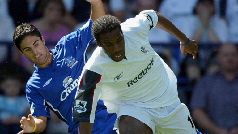 Mikel Arteta squaring up against J.J Okocha in the Premier League || Image credit: Imago