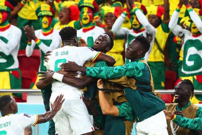 Senegal celebrating after becoming one of only two African nations to advance to the round of 16 of the World Cup in Qatar