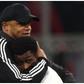 Vincent Kompany and Super Eagles' Nathan Tella embrace each other after the game.