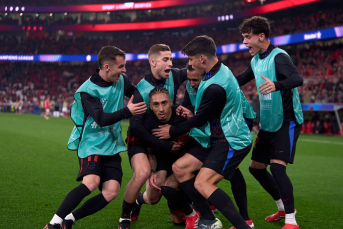 Raphinha of FC Barcelona celebrates with his team mates after scoring his team s first goal during the UEFA Champions League 2024 25 UEFA Champions League 2024 25 Round of 16 first leg || Image credit: iMAGO