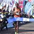 Victor Kipchirchir cuts the tape at the 2022 Eldoret City Marathon